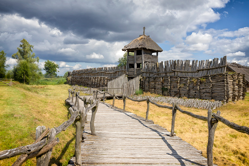 Biskupin, Poland - August 25,2020:Reconstruction of the rampart and gate to the Slavic settlement in the Archaeological Museum in Biskupin, Poland