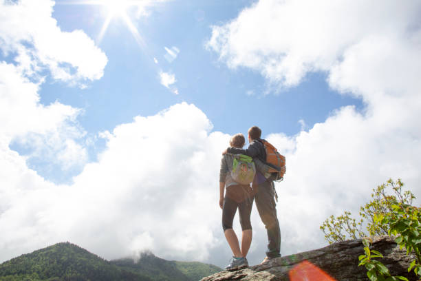 istock Hikers relax on mountain ridge before heading down 1316821734