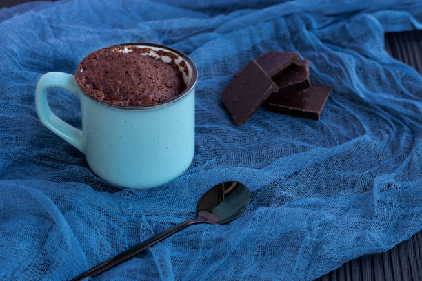 istock a chocolate cupcake in a mug is cooked in the microwave. 1316824200