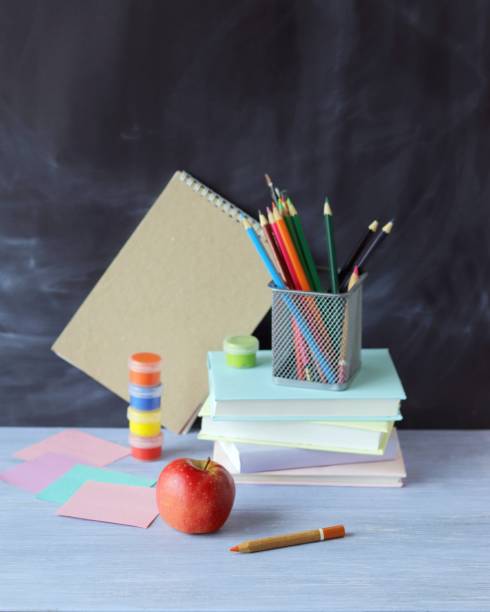 istock Stationery, apple on school board background, learning concept, back to school 1316829927