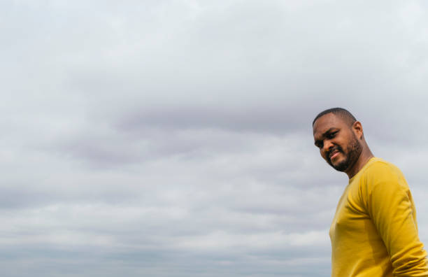 istock Black man looking at the horizon in a park 1316831139