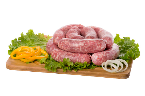raw pork sausage on cutting board.