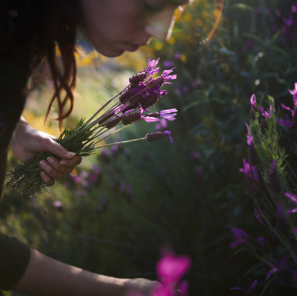 istock Girl picking flowers 1316832675