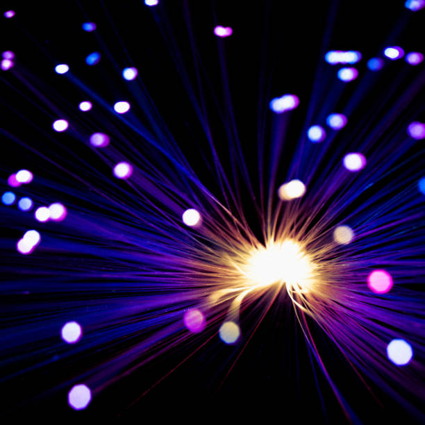 istock Abstract Orange and Purple Fiber Optic Background 1316832815