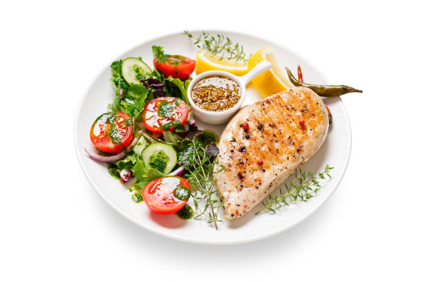 istock Grilled chicken breast with fresh vegetable salad. 1316833064