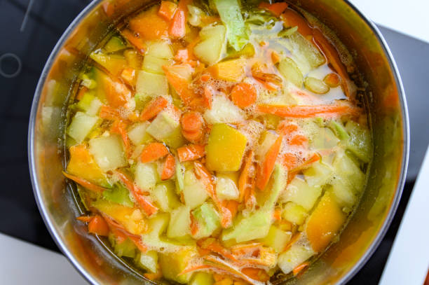 istock Cooking Bright Vegetable Soup on the Stove 1316834049