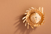 small straw hat used for festa junina ornaments on brown background