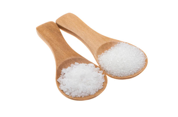 istock wooden spoon with sugar isolated 1316835643