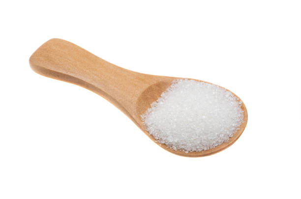 istock wooden spoon with sugar isolated 1316835658