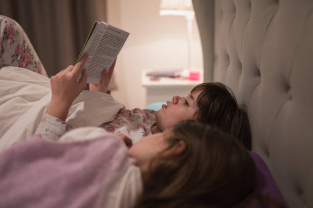 istock Girls reading before sleep 1316839206