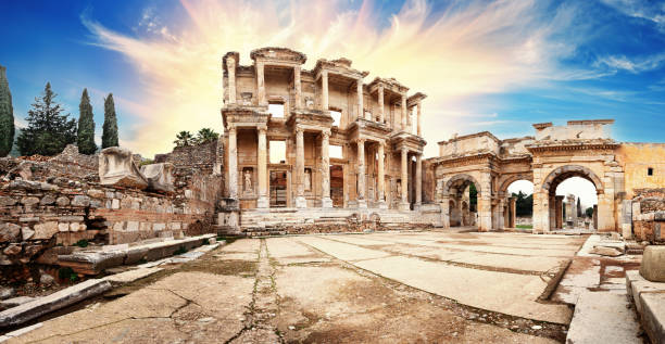 Panorama of ancient library of Celsus in Ephesus under dramatic sky Panorama of the ancient library of Celsus in Ephesus under a dramatic sky. Turkey. UNESCO cultural heritage celsus library photos stock pictures, royalty-free photos & images