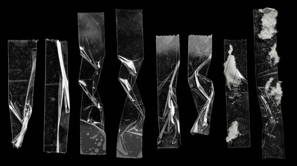 set of transparent adhesive tape or strips isolated on black background with ripped paper remain. - adhesive tape imagens e fotografias de stock