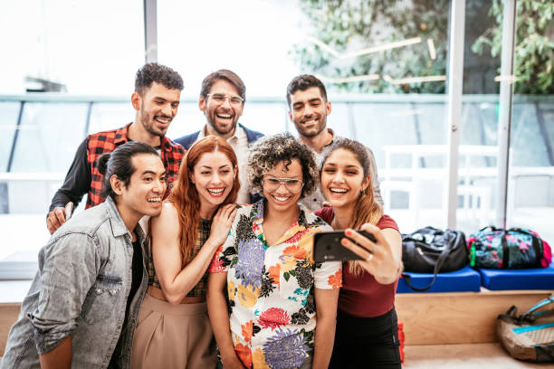 istock Group of diverse multi ethnic people looking at camera and smiling 1316843074
