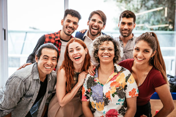 istock Group of diverse multi ethnic people looking at camera and smiling 1316844099