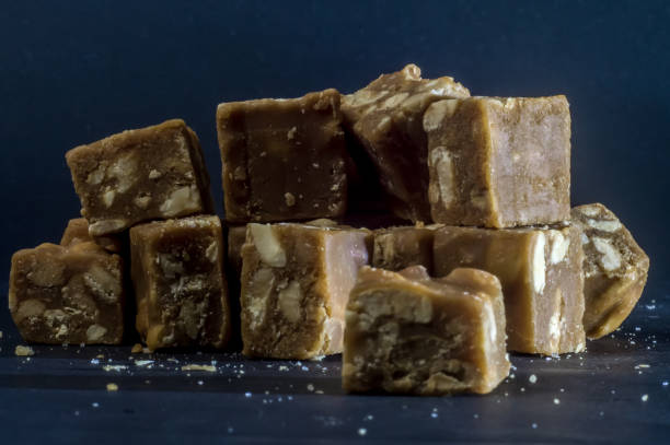 istock Brazilian sweet called Pe de moleque cut into cubes in a transparent container 1316845287
