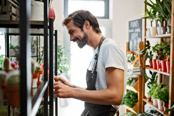 istock Dedicated male florist working with flowers 1316845898