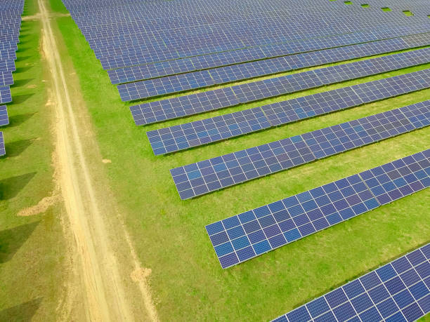 istock Drone view of a solar power plant on a sunny day. Solar farm system with a drone. A source of ecological renewable energy 1316845958