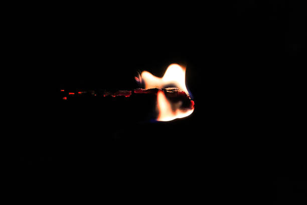 extinguished matchstick and burnt paper