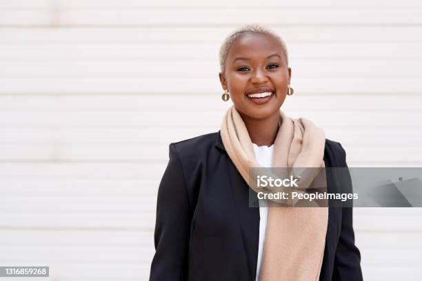 Portrait Of A Young Businesswoman Standing Against A White Background Stock Photo - Download Image Now