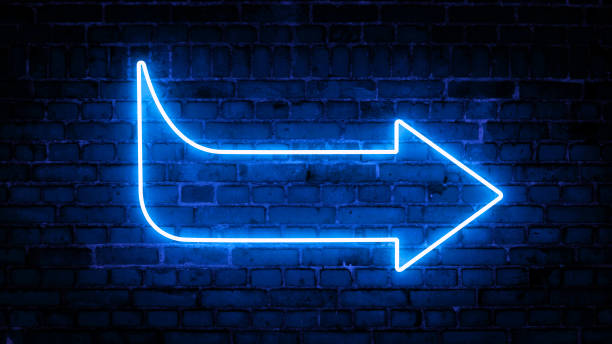 istock 3D rendering of glowing neon arrows on a brick wall background 1316859468
