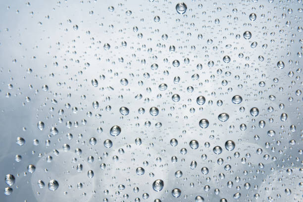 istock Water droplets on glass with blurred soft light bokeh background. Bokeh pattern. Wallpaper. Bokeh background. 1316860507