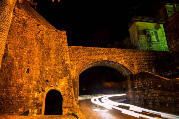 istock stone walls at night in Herceg Novi 1316868896