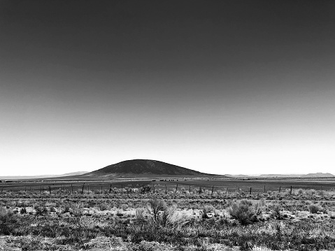 Ute Mountain New Mexico. Ute Mountain is a volcanic cone in northern New Mexico and the highest point of the Rio Grande del Norte National Monument. Copy space in the sky.