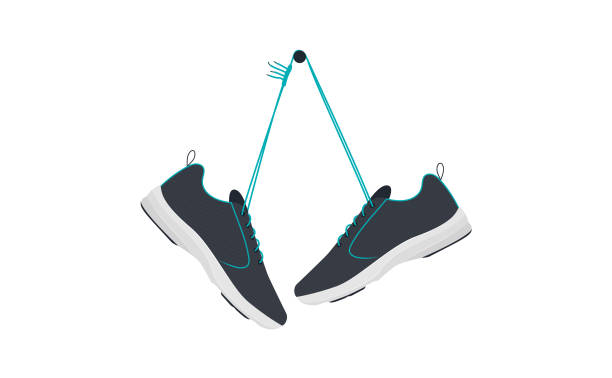 Shoes of pairs hang on nail Shoes hanging background. Vector graphic design. running shoes white background stock illustrations