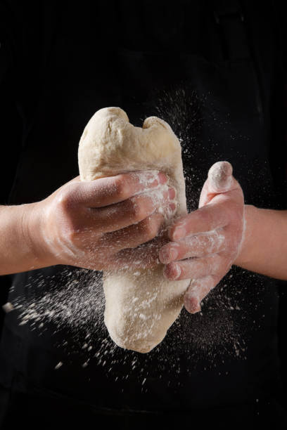 istock Culinary, cooking, baking concept. Female hands kneading dough 1316875987