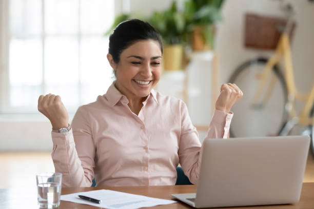 istock Happy professional celebrating success and making winner gesture 1316877976
