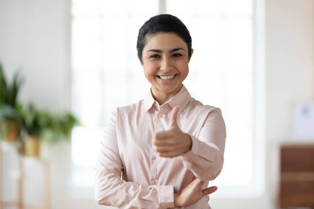 istock Confident young Indian woman making thumb up 1316877994