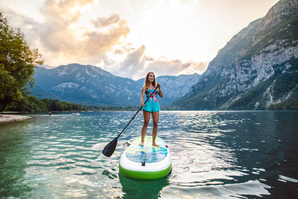 istock Mid Adult Caucasian Woman Approaching on Paddleboard 1316878105