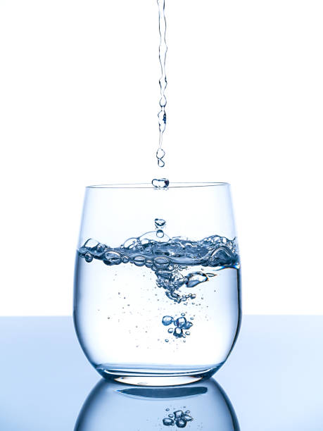 istock Water pouring into glass 1316878228