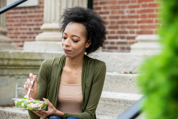 istock Professional woman eating outdoors during her lunch break 1316879808