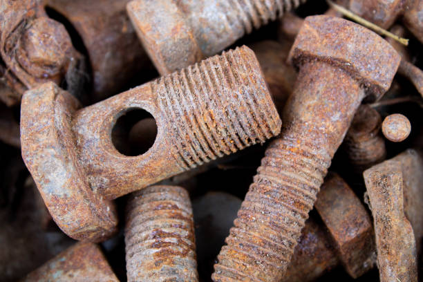istock Old rusty bolts and nuts. Fasteners on the trash can. 1316884266