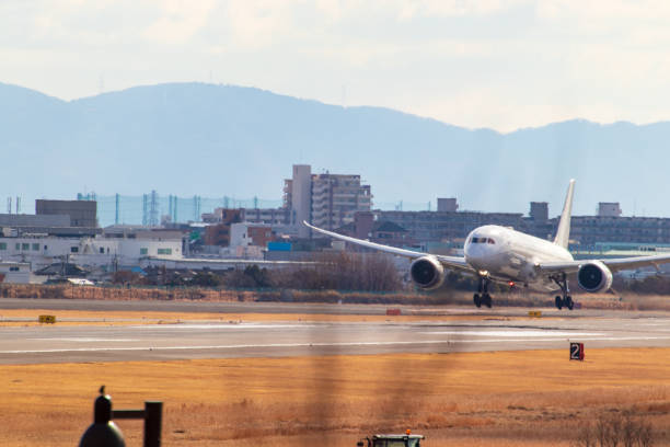 istock A white airplane landing on the runway 1316888461