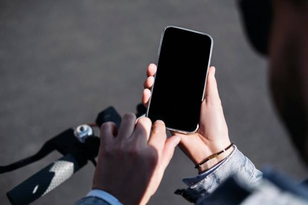 istock A man using a phone on the street 1316889178
