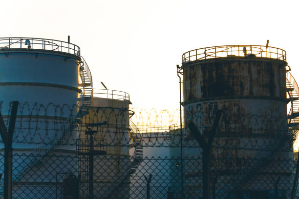 istock An oil refinery as seen from behind a chain link fence. 1316892099