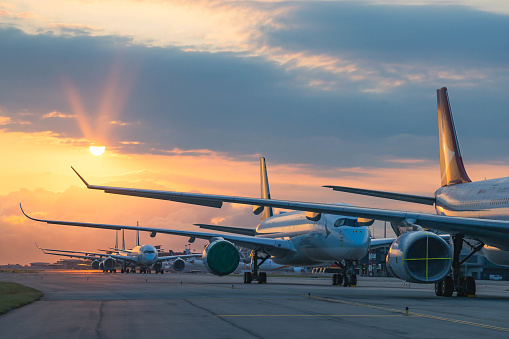 Hong Kong, May 10,2020: Due to Coronavirus Covid-19 airline fleet grounded at the Airport taxiway. The largest Hong Kong based carrier Cathay Pacific Airways grounded most of their aircraft fleet. Those aircrafts lined up at on the taxiway and waiting to transfer to out port for a long term parking.