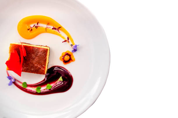 istock Sweet corn cheesecake with purple corn and mango sauces on a white background. 1316896691