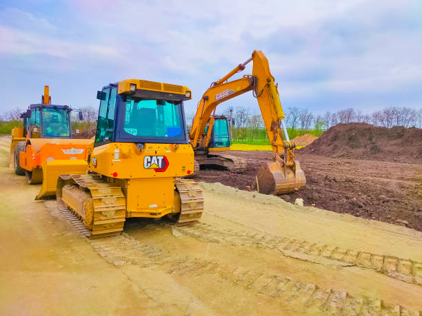 yellow tractor caterpillar by cat - editorial land vehicle construction equipment built structure imagens e fotografias de stock