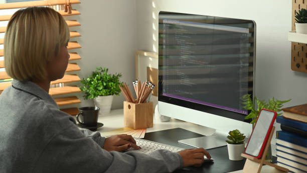 istock Side view young female programmers working on new project at the office. 1316898356