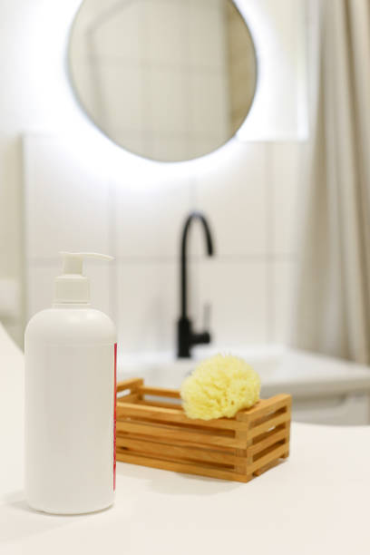 istock White Plastic dispenser bottles with body cream 1316899114