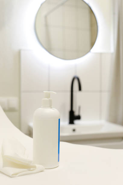 istock White Plastic dispenser bottles with body cream 1316899115