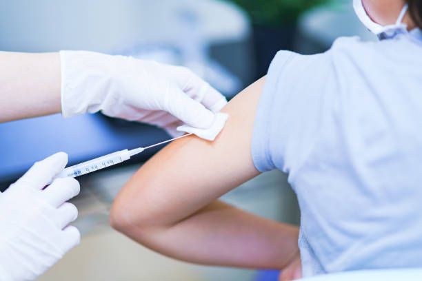 istock corona virus vaccine injection to child 1316899134