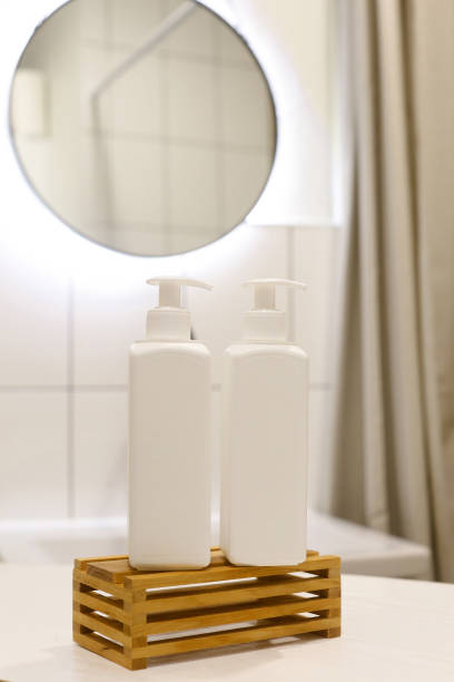 istock White Plastic dispenser bottles with body cream 1316899249