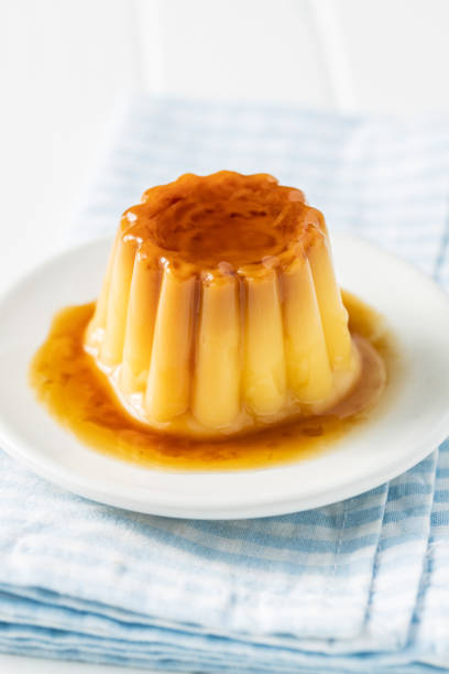 istock Sweet vanilla pudding. Sweet dessert with caramel topping. 1316900329