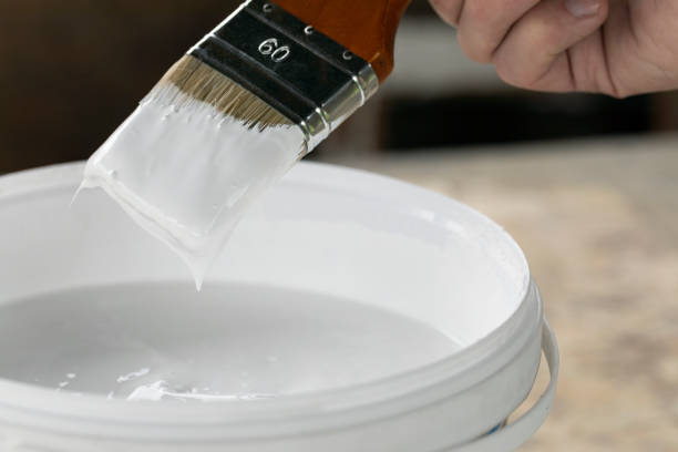 istock Brush in hand ready to paint with acrylic paint 1316900330