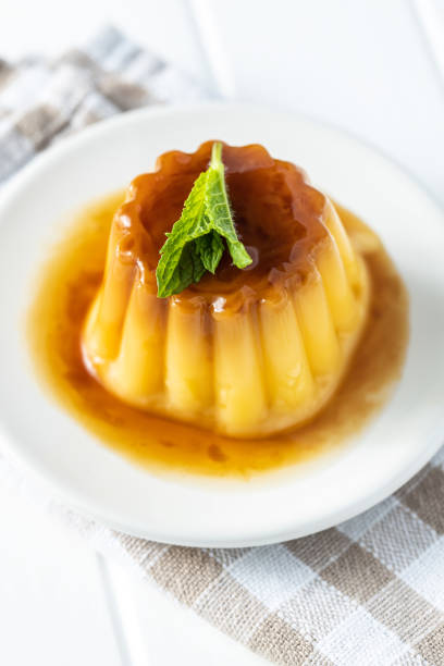 istock Sweet vanilla pudding. Sweet dessert with caramel topping. 1316900352