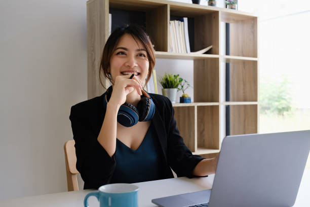 istock Female executive thinking over working schedule for employee writing report into digital laptop in coworking space. 1316905632